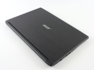 a laptop computer sitting on top of a white table