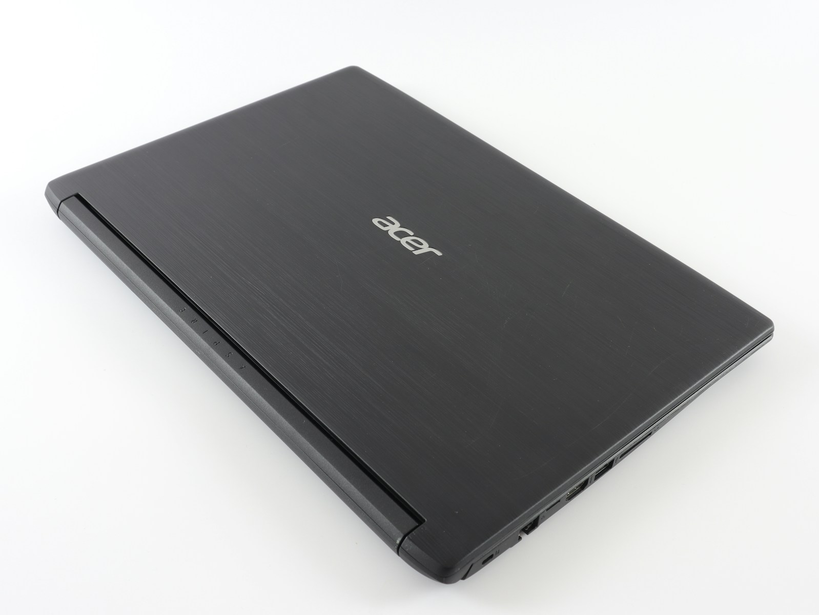 a laptop computer sitting on top of a white table